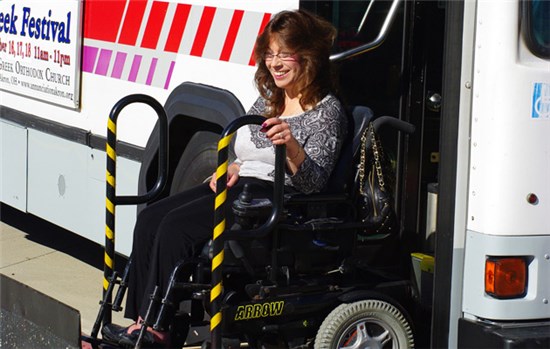 METRO ADA passenger in a wheelchair exits bus
